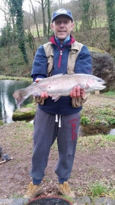 Dylan Thomas catching a Rainbow Trout